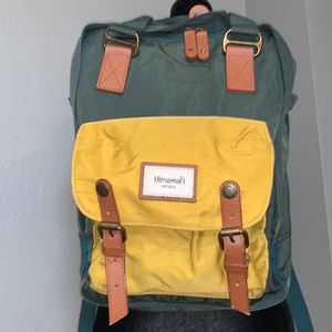 Himawari backpack green and gold lots of organization in great condition laptop